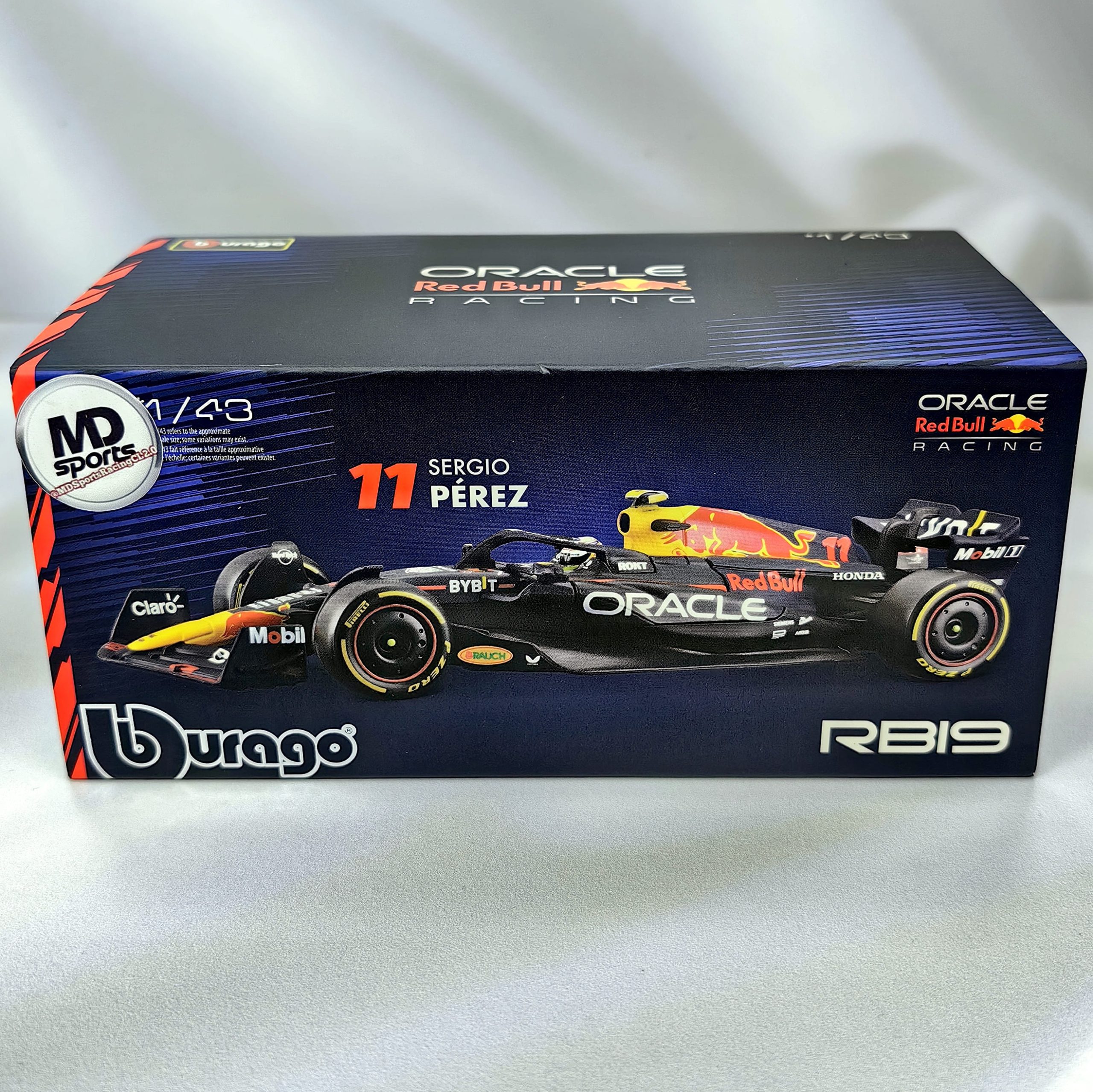 RedBull RB19 2023 #11 Checo Perez Caja Acrilica Burago 1:43 + Llavero Polera