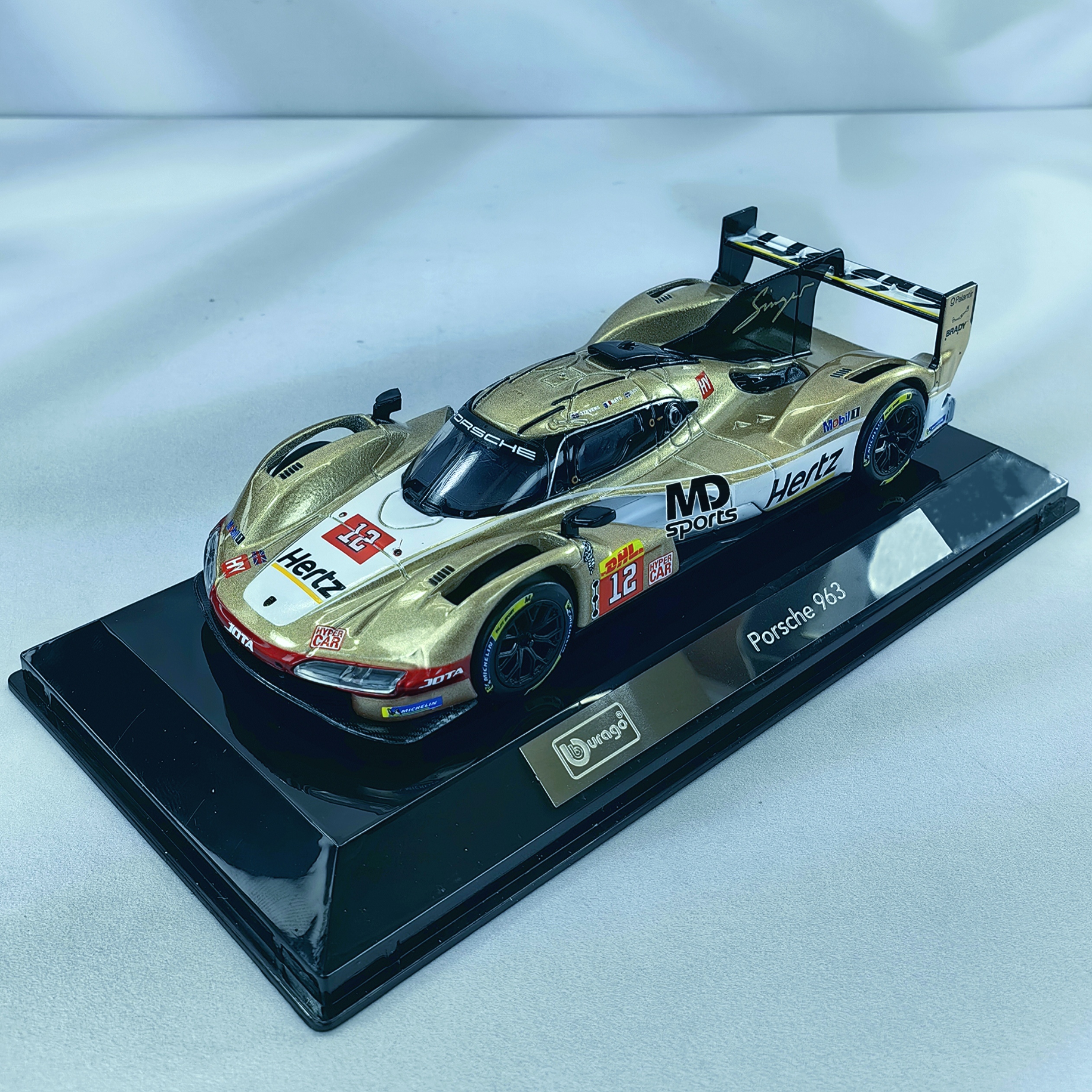 Porsche 963 LeMans 2024 #12 Stevens-Nato-Ilott Caja Acrilica Burago 1:43 - Imagen 3