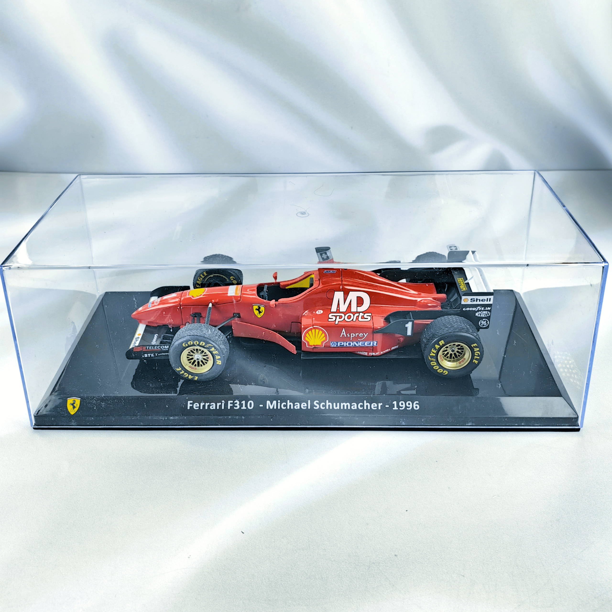 Ferrari F310 1996 #1 Michael Schumacher Caja Acrilica Premium Collect 1:24