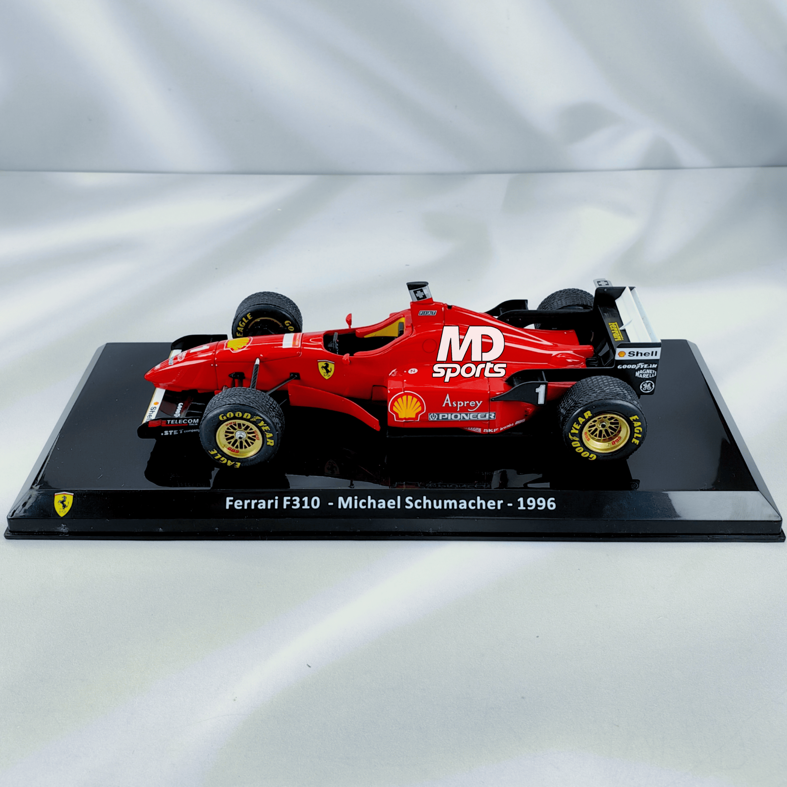 Ferrari F310 1996 #1 Michael Schumacher Caja Acrilica Premium Collect 1:24